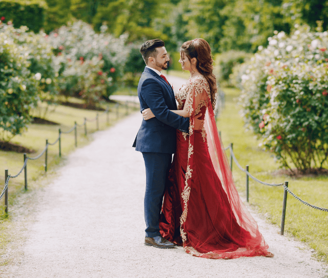 beautiful-woman-long-red-dress-walks-around-city-with-her-husband