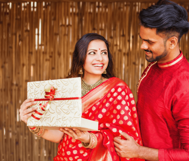 indian-woman-opening-gift-from-her-husband
