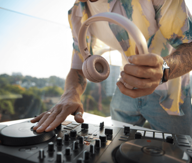 side-view-dj-holding-headphones